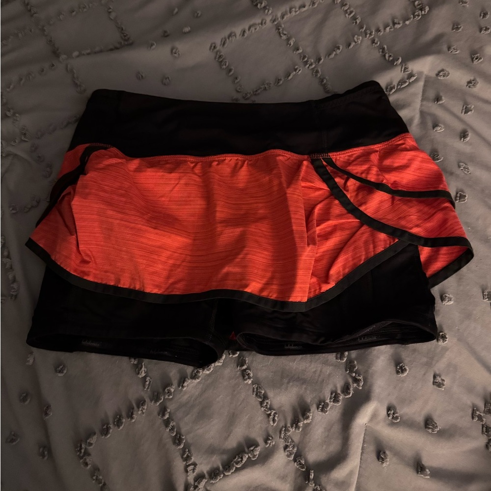 Lululemon Athletica Black and Orange Athletic Shorts